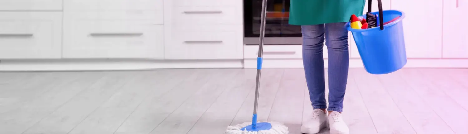 A freshly mopped, spotless kitchen floor after a house cleaning
